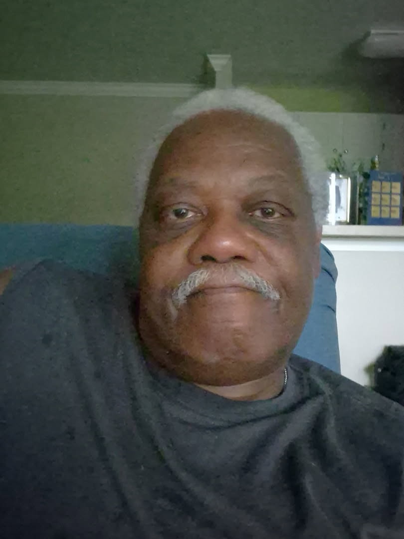 Dr. Ray Howard, founder of RH Consulting Company LLC, seated in his office